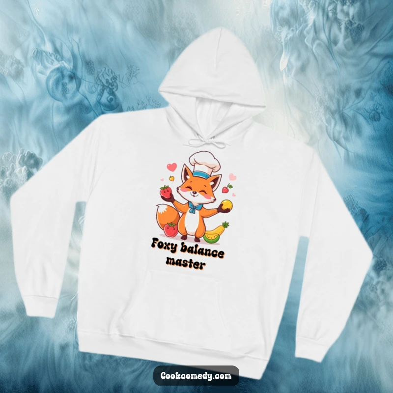 Funny fox in a chef hat juggling fruits, printed on a soft, warm hoodie, ideal for chilly days and laughs.
